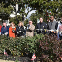 Ambassador Garden to UPWPRG in Stockton at Police Dept. 2017 Men and women holding shears