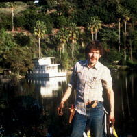 TJ planting Lake Shrine Garden 1984 Young TJ planting by the lake shrine