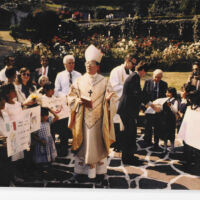 Dedication in Mexico City 1989 children and adults listening to a priest