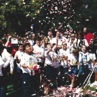 State Capitol Groundbreaking 2002 boys and girls in white clothes throwing rose petals in the air