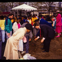 Atlanta Planting 1992 Men in suits and women in dresses are planting roses