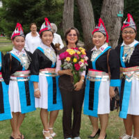 Hmong dancers 2014 Hmong dancers in national clothes gathered around Silvia holding rose boquet