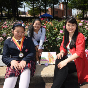 Chinese Winner-Atlanta 2018 Chinese Family gathered around a plaque