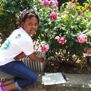 Atlanta Student Girl revealing a plaque