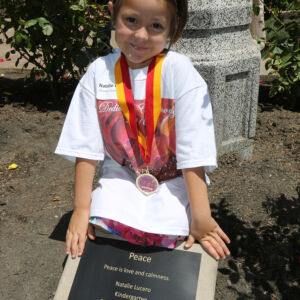 Stockton Winner 2016 a girl next to a plaque