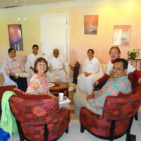 Gathering at Brahma Kumaris Center Sacramento People of different nationalities gathered around a coffee table