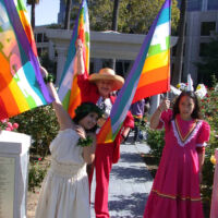 International Day of Peace 2005 People in festive clothing holding rainbow flags