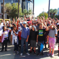 School Tour State Capitol WPRG 2016 People are walking with their arms in the air
