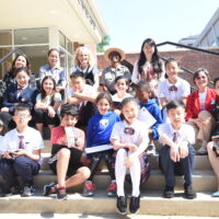 Atlanta Int'l School & Chinese winners & Teachers 2018 Children sitting on school steps