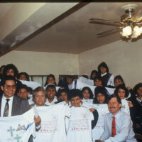 Mexico City 1989 Children and adults wearing white and holding art