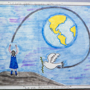 Mexico City A girl is sanding a white dove to fly around the Earth