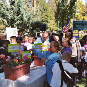 Planting Qualities 2005 People panting plaquards with messages of qualities