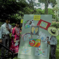 International Friendship Program Mexican Students at State Capitol 2013 Students in Mexican traditional costumes looking at an art board